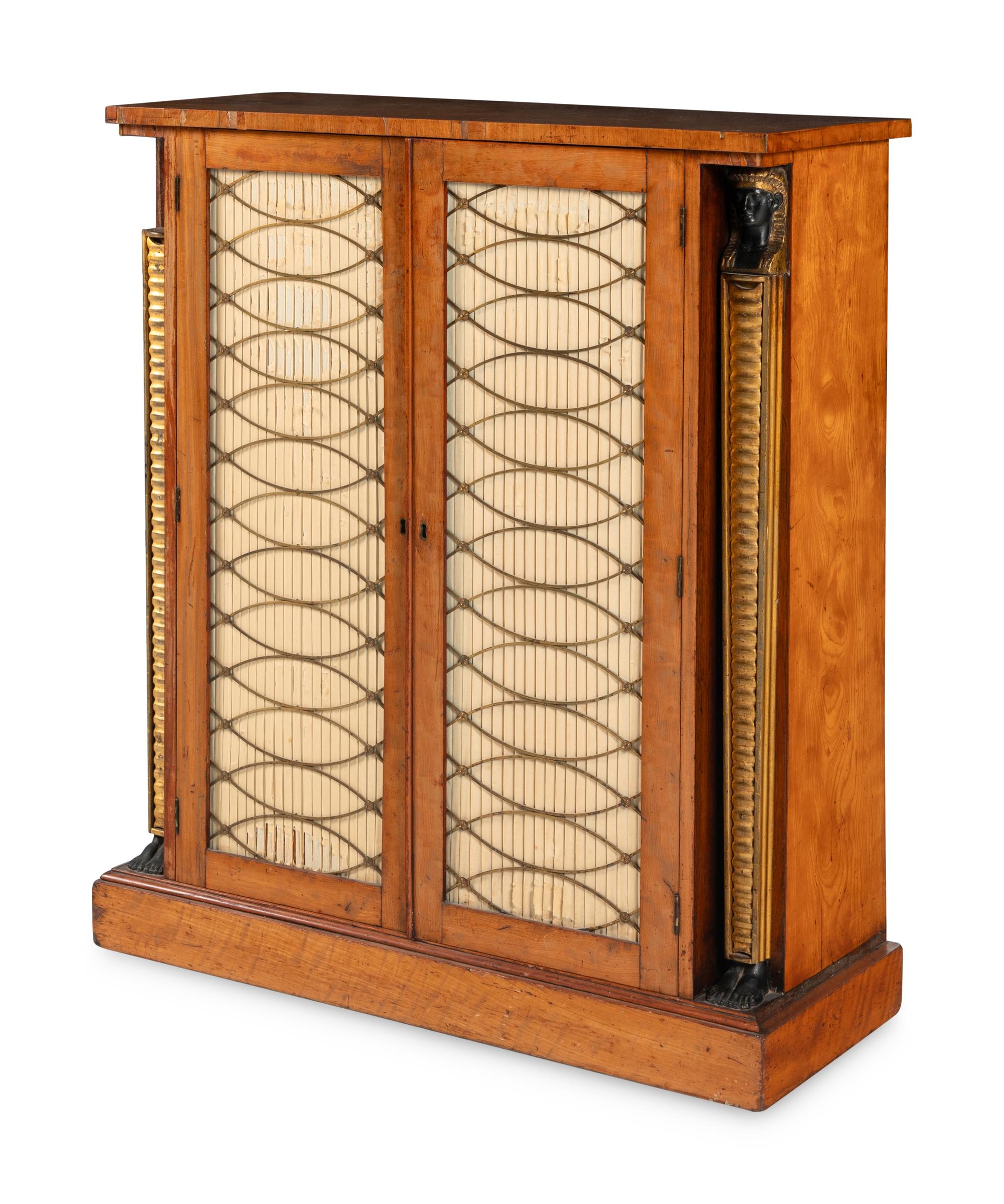 A Regency Satinwood, Part Ebonized and Parcel Gilt Cabinet