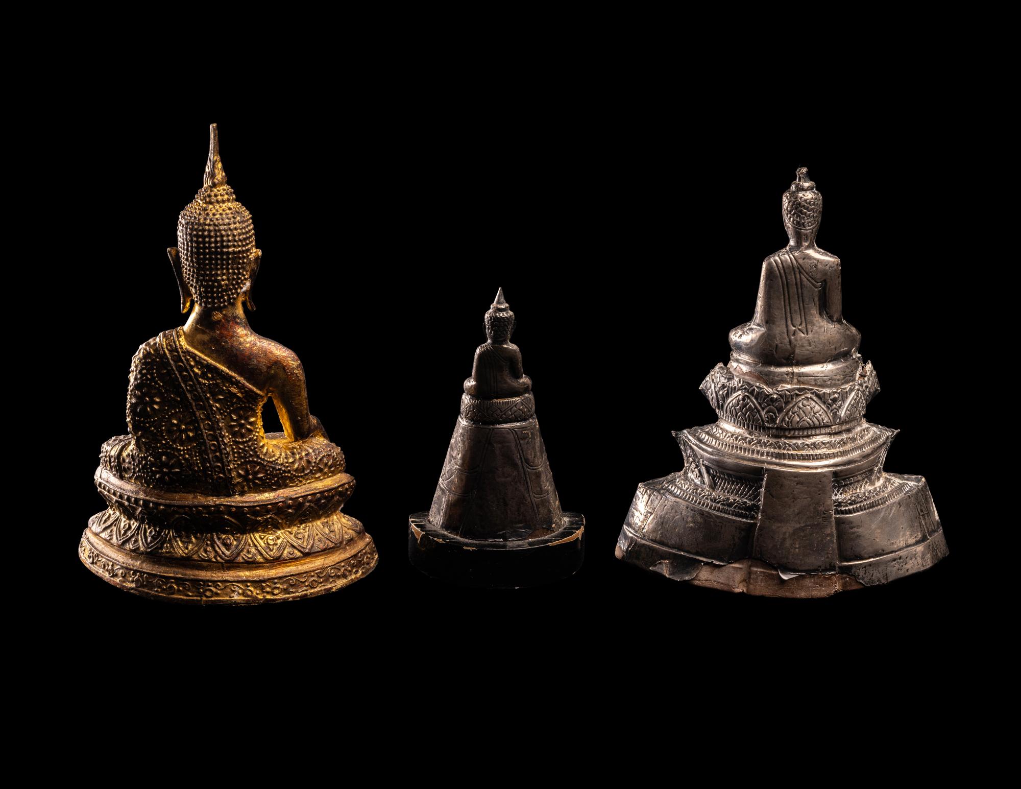 Three Thai Silver Veneered and Gilt Bronze Figures of Seated Buddha