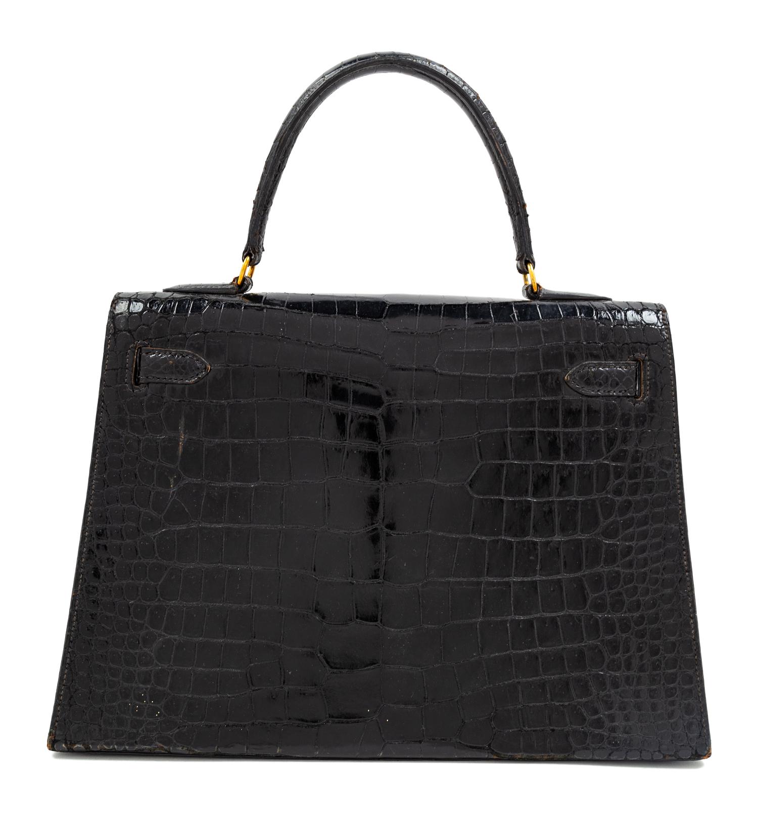 An Hermès Vintage Black Crocodile Kelly Bag, 9" L x 13" W x 4.5" D; Handle drop: 4.5".