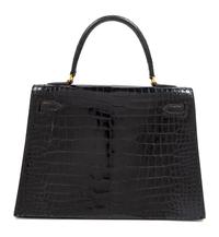An Hermès Vintage Black Crocodile Kelly Bag, 9" L x 13" W x 4.5" D; Handle drop: 4.5".