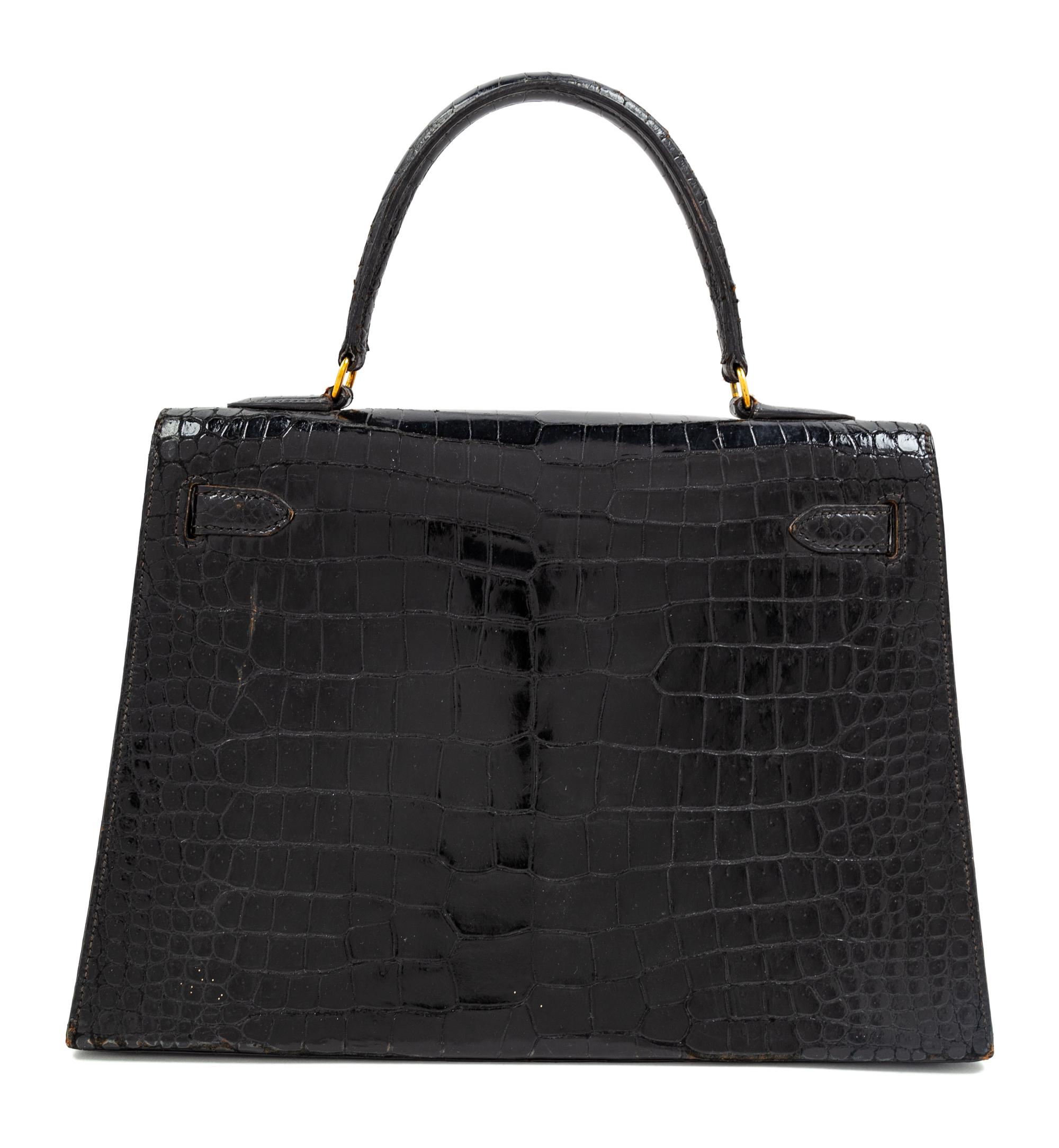 An Hermès Vintage Black Crocodile Kelly Bag, 9" L x 13" W x 4.5" D; Handle drop: 4.5".
