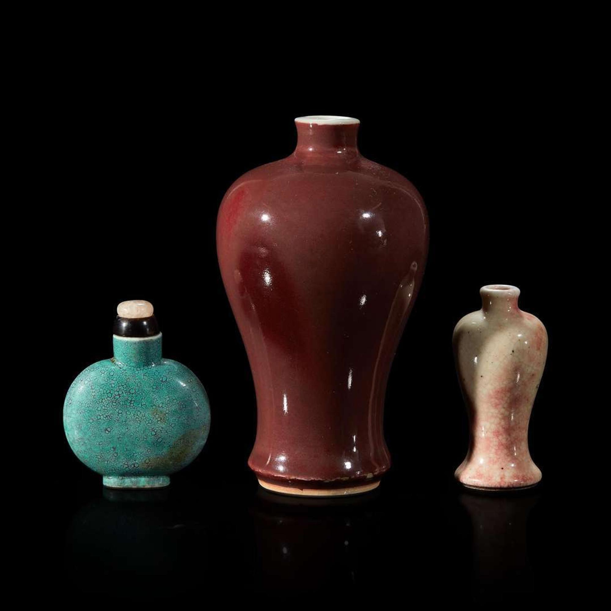 A Chinese red-glazed small meiping and two porcelain snuff bottles