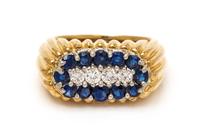 An 18 Karat Yellow Gold, Platinum, Sapphire and Diamond Band, Oscar Heyman Brothers, 10.70 dwts.