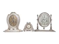 A Collection of Three Silver Desk Clocks