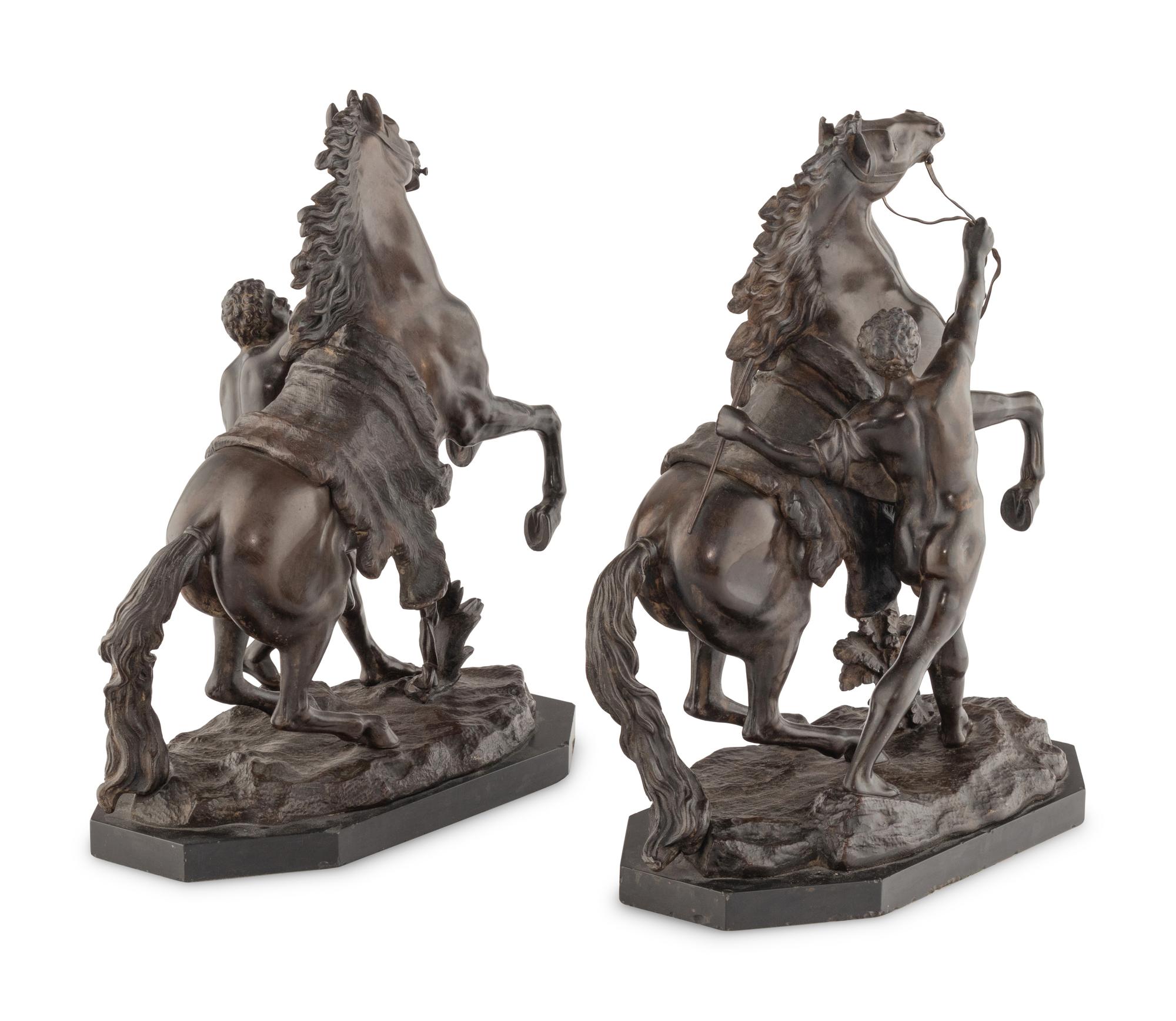 A Pair of French Bronze Models of Marly Horses