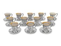 A Set of Twelve American Silver Martelé Coffee Cups and Saucers