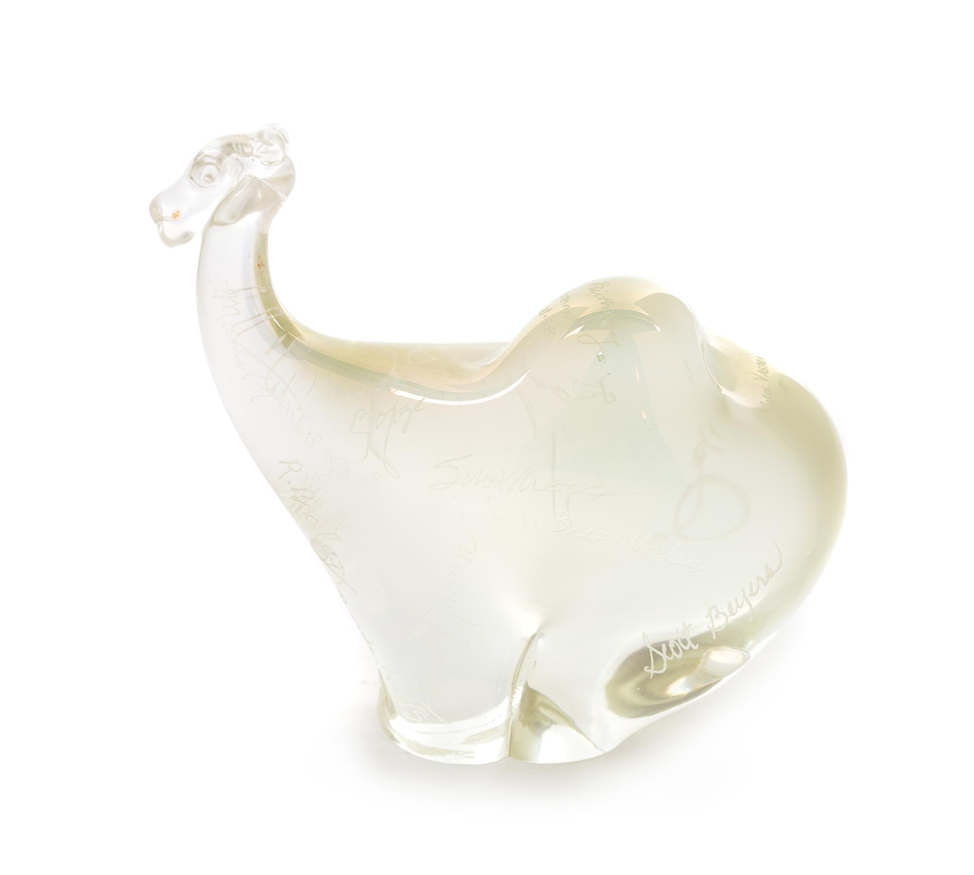 Orient & Flume, Chino, California, a camel iridescent glass paperweight with etched signatures throughout, 1988