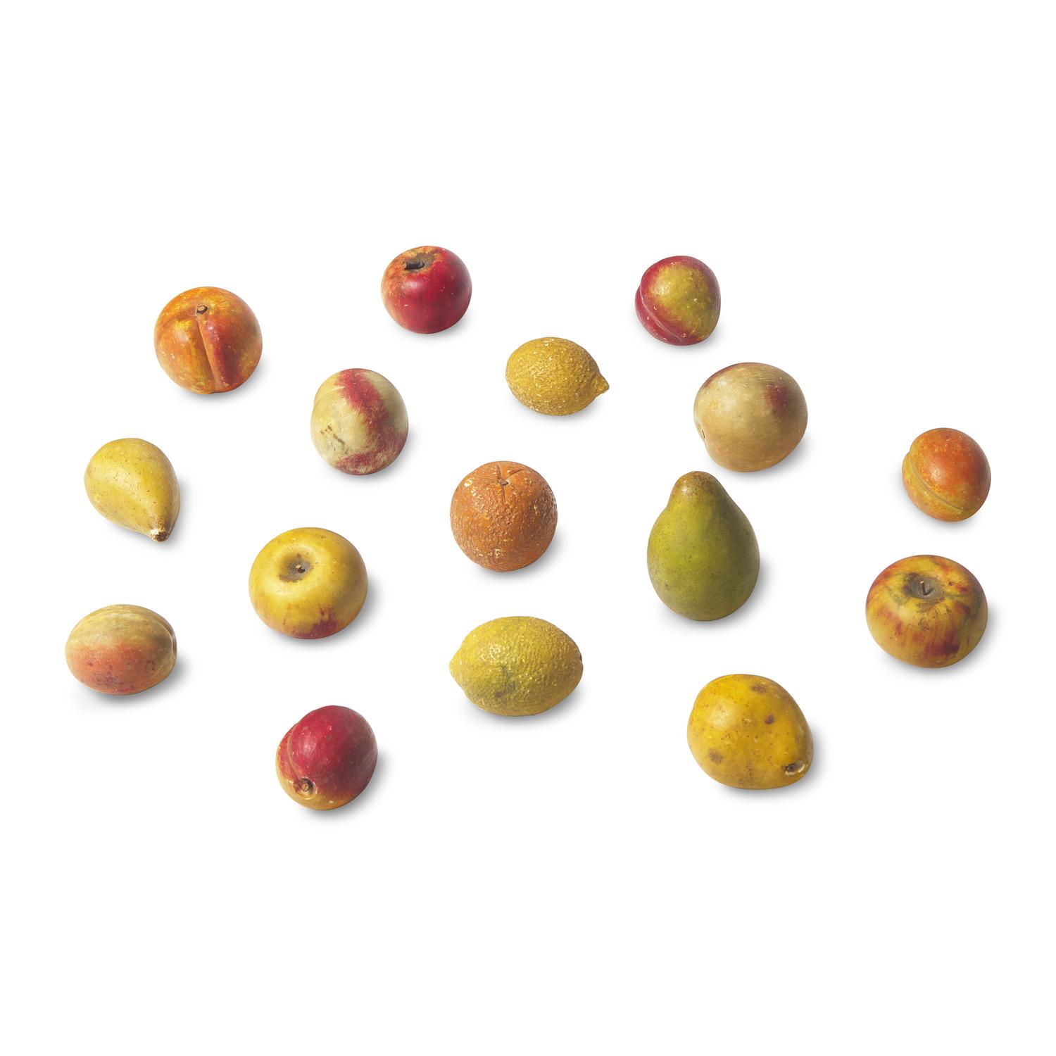 A Group of Sixteen Painted Stone Fruit