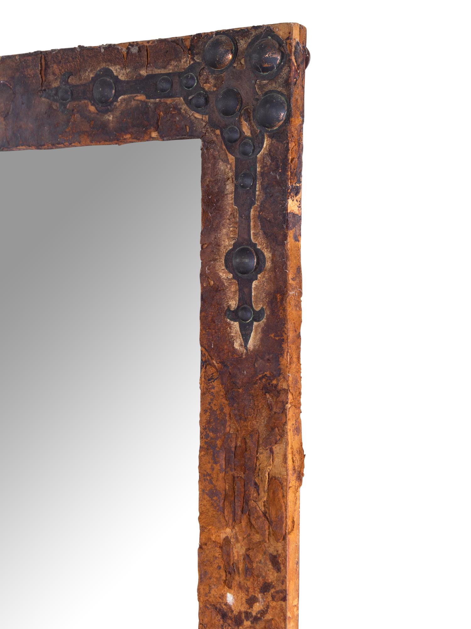 A Continental Iron Mounted Velvet Framed Mirror
