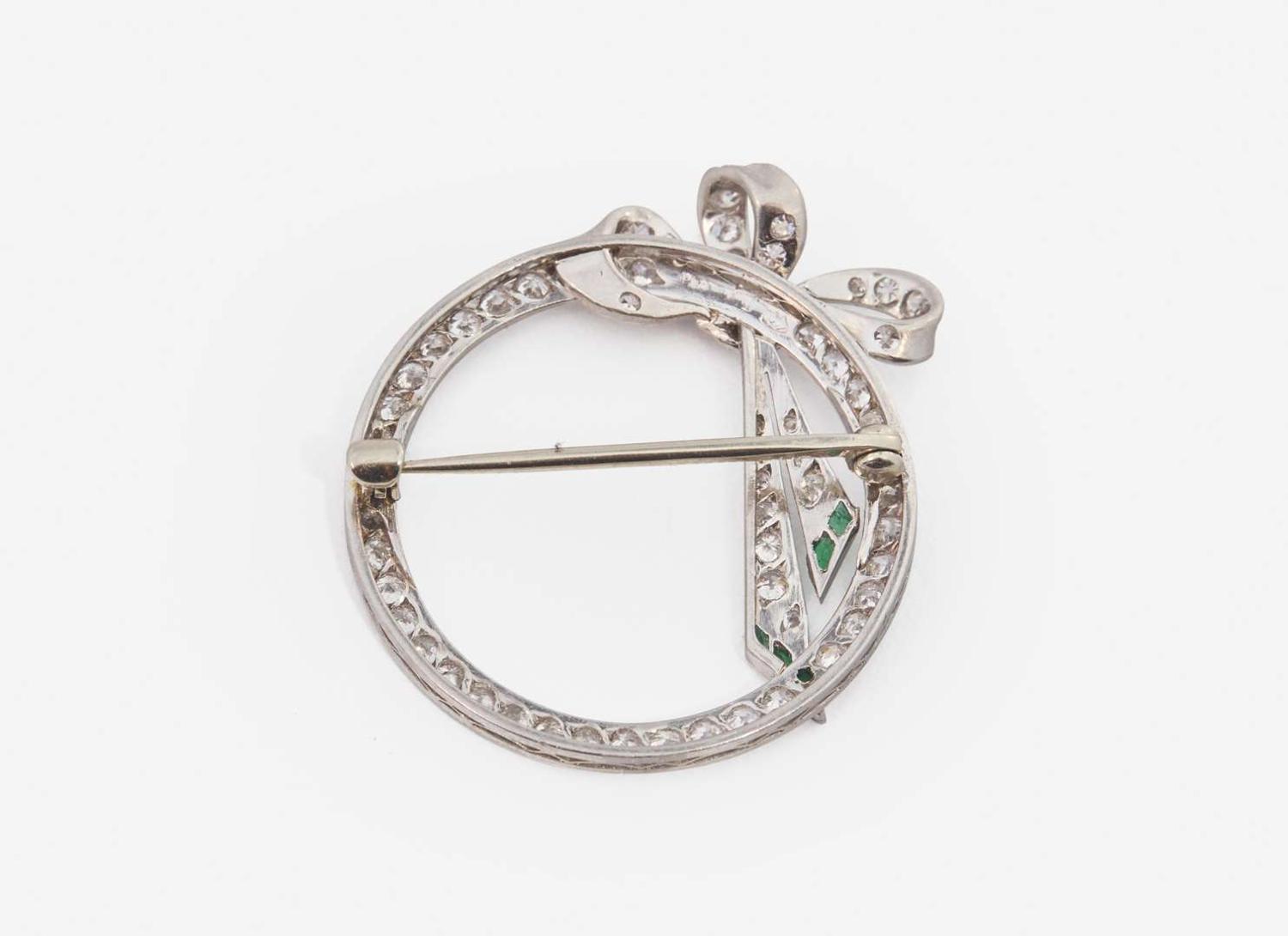 A Platinum and Diamond Circle Pin
