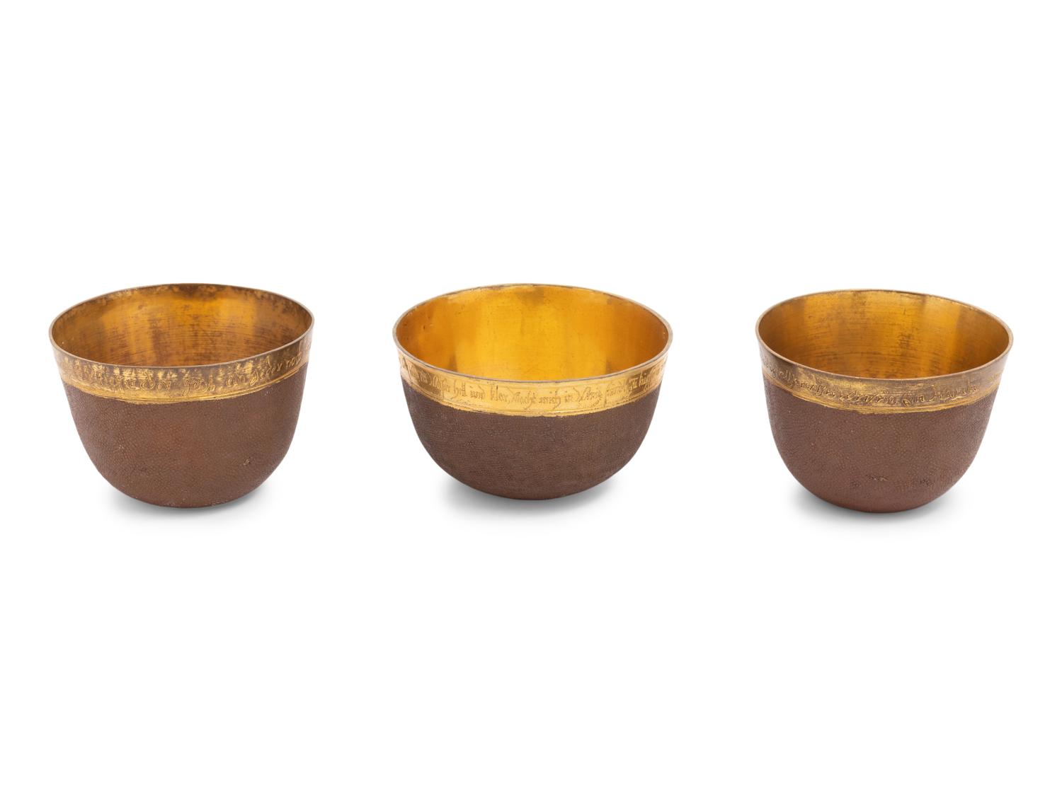 A Group of Three Continental Gilt Metal Herrengrund Cups