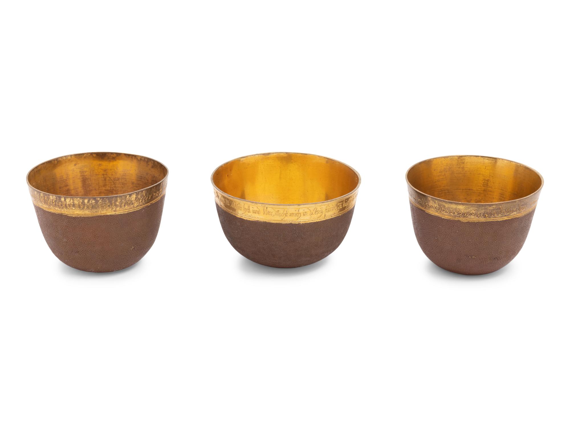 A Group of Three Continental Gilt Metal Herrengrund Cups