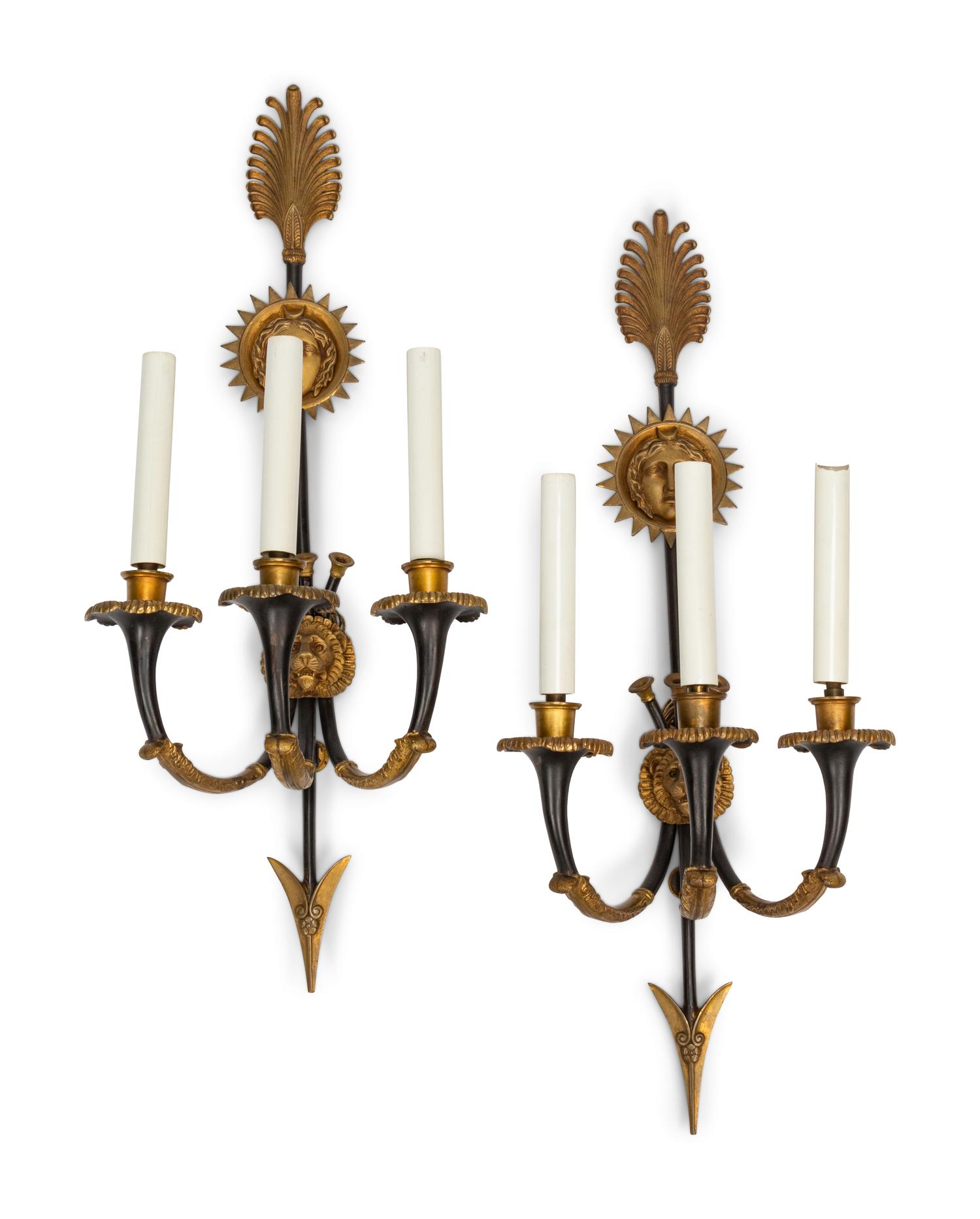 A Pair of Empire Style Gilt and Patinated Bronze Three-Light Sconces