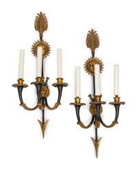 A Pair of Empire Style Gilt and Patinated Bronze Three-Light Sconces