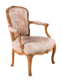 A Louis XV Carved Fruitwood Fauteuil