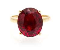 An 11.58 Carat Oval Mixed Cut Burmese Red Spinel, 4.30 dwts. (with setting)
