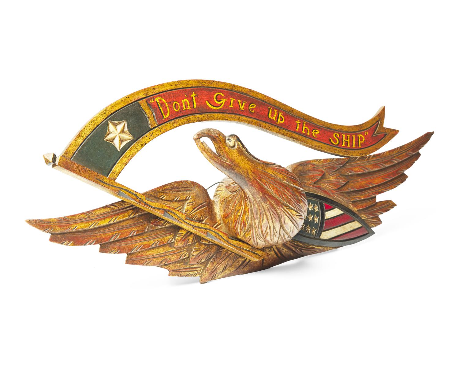 A Carved and Painted Giltwood Eagle