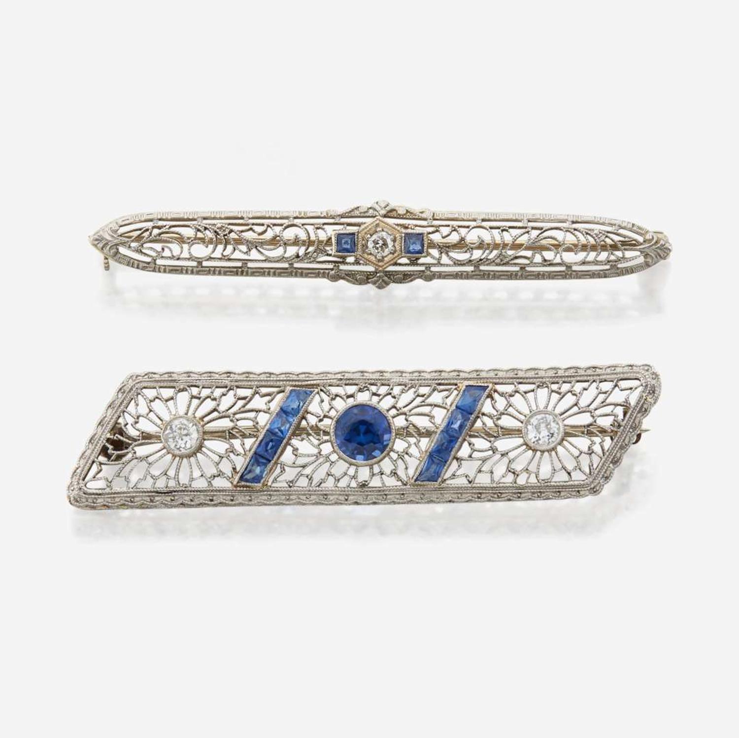 A pair of Art Deco white gold and diamond brooches