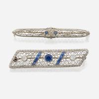 A pair of Art Deco white gold and diamond brooches