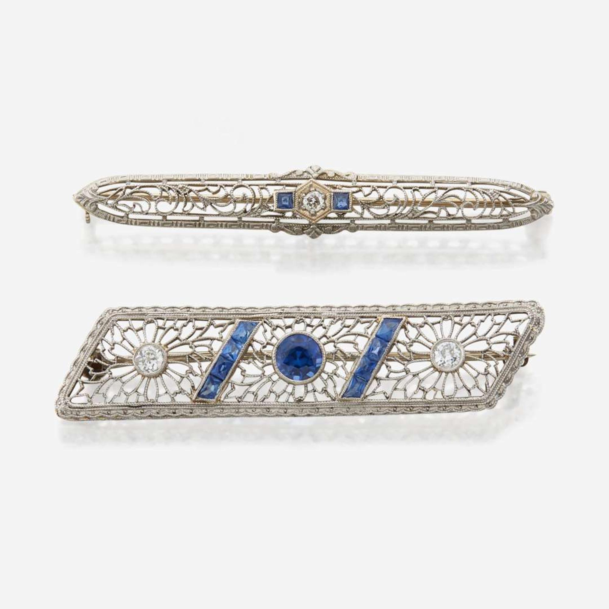 A pair of Art Deco white gold and diamond brooches