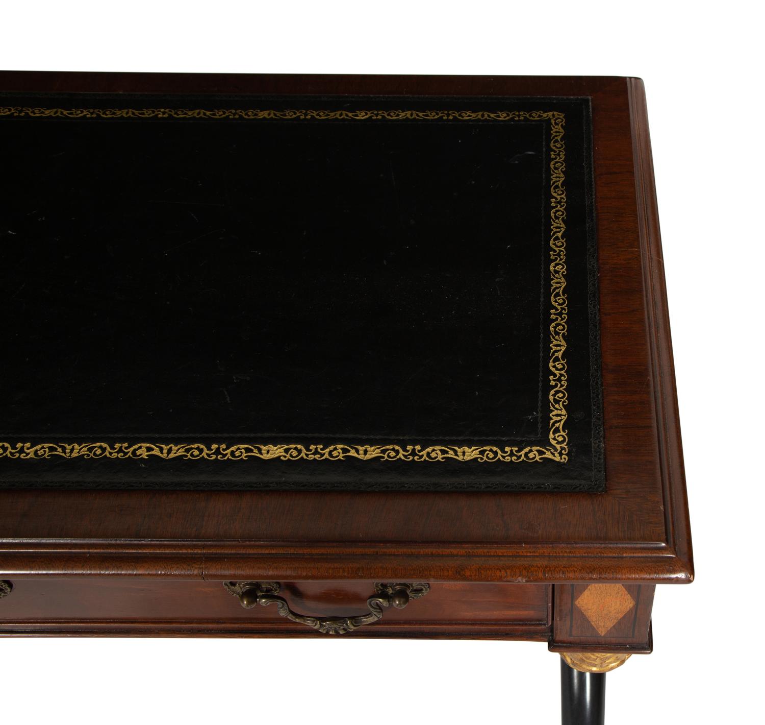 A Regency Style Parcel Gilt and Ebonized Mahogany Leather Top Console Table