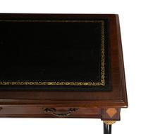 A Regency Style Parcel Gilt and Ebonized Mahogany Leather Top Console Table