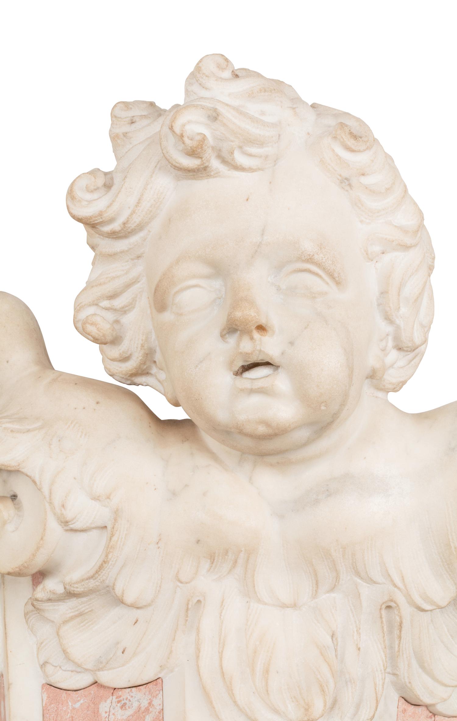 A Pair of Italian Carved Marble Figural Corbel Capitals