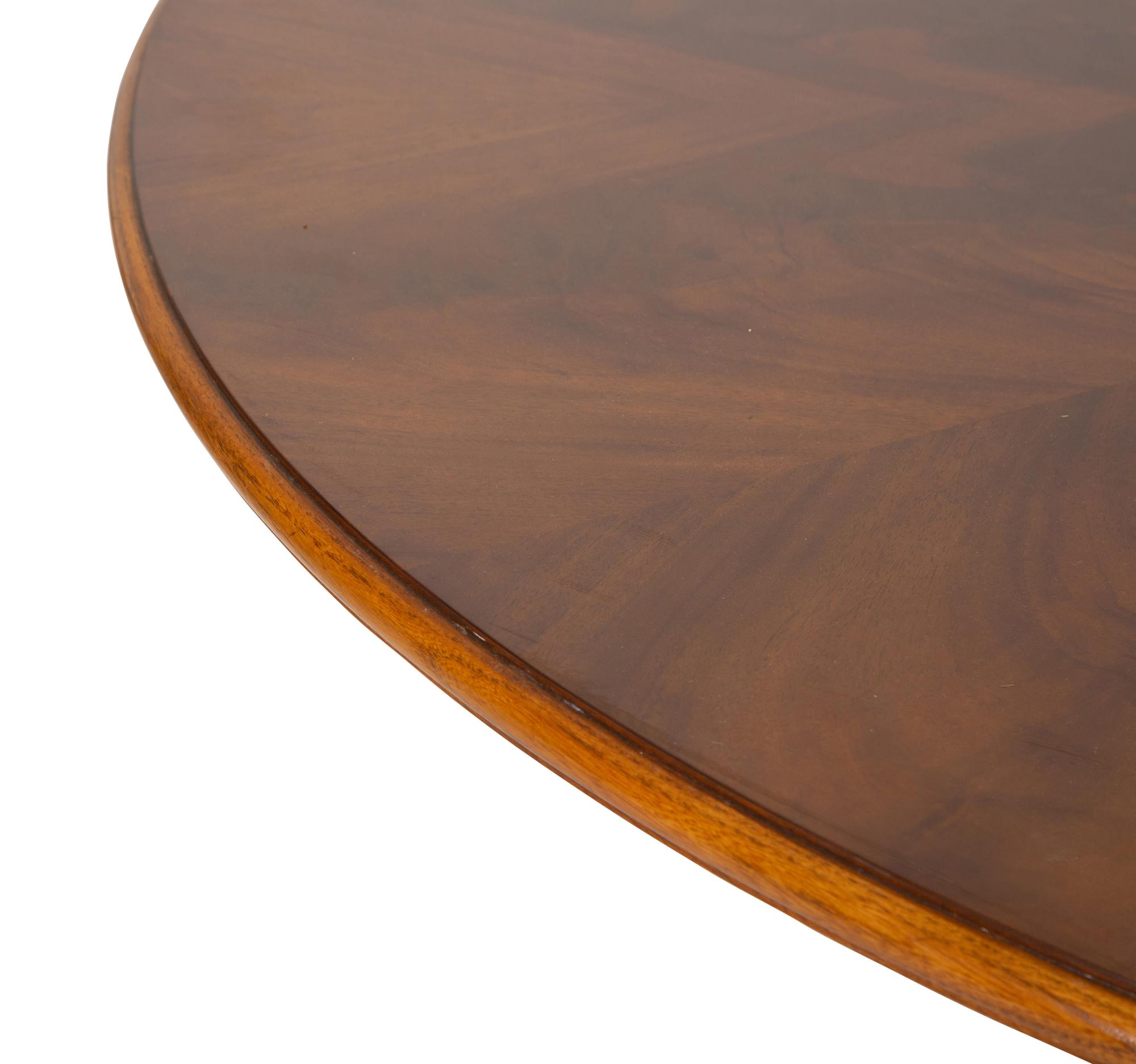 A Pair of Regency Style Mahogany Circular Dinner Tables