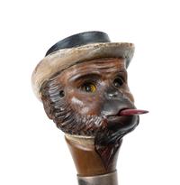 An English Silver and Glass Mounted Carved Wood Automaton Monkey Walking Stick