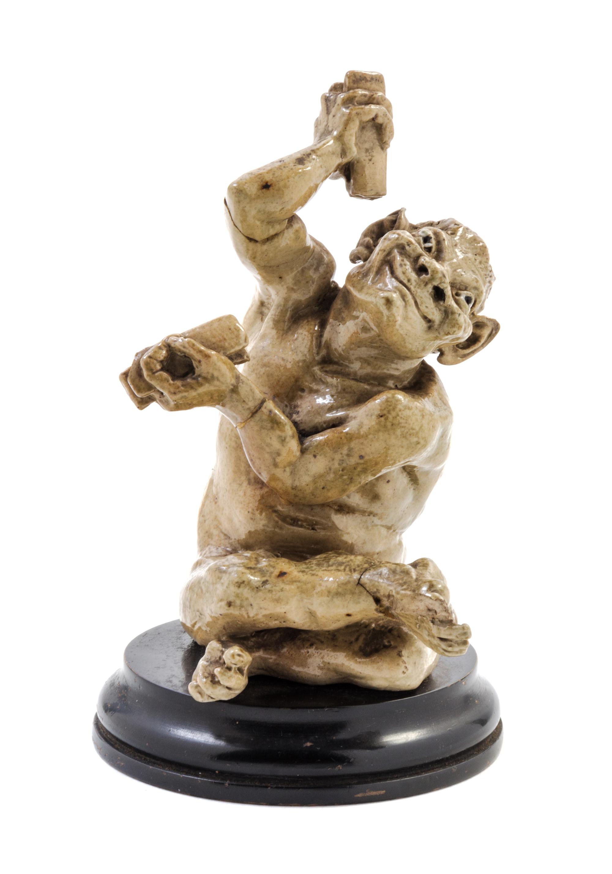 A Martin Brothers Stoneware Figure Height overall 5 3/4 inches. — LATE 19TH CENTURY