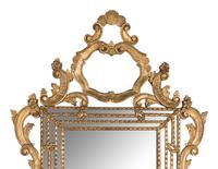 An Italian Baroque Style Giltwood Mirror
