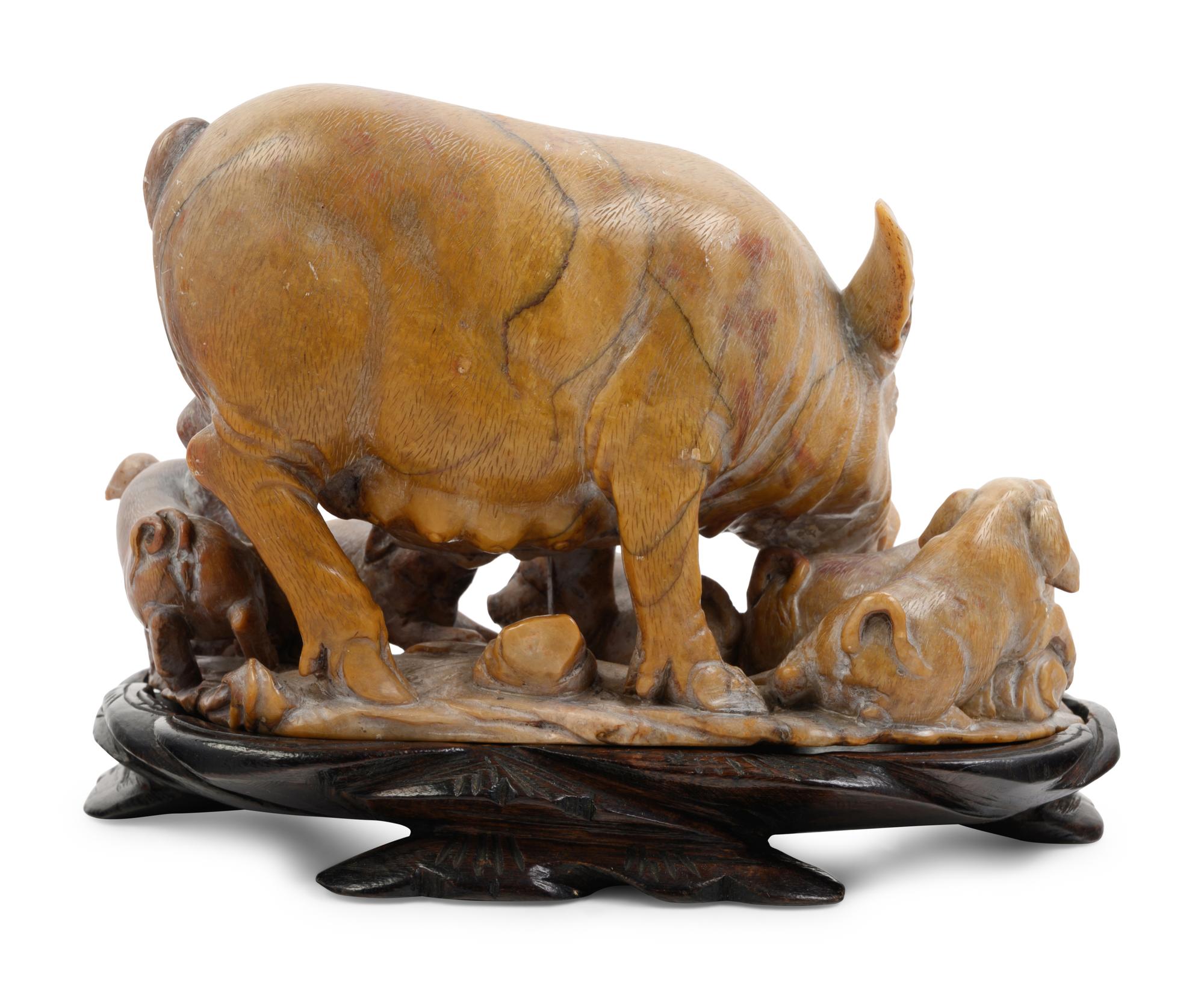 A Chinese Carved Soapstone Figure of Pig and Piglets