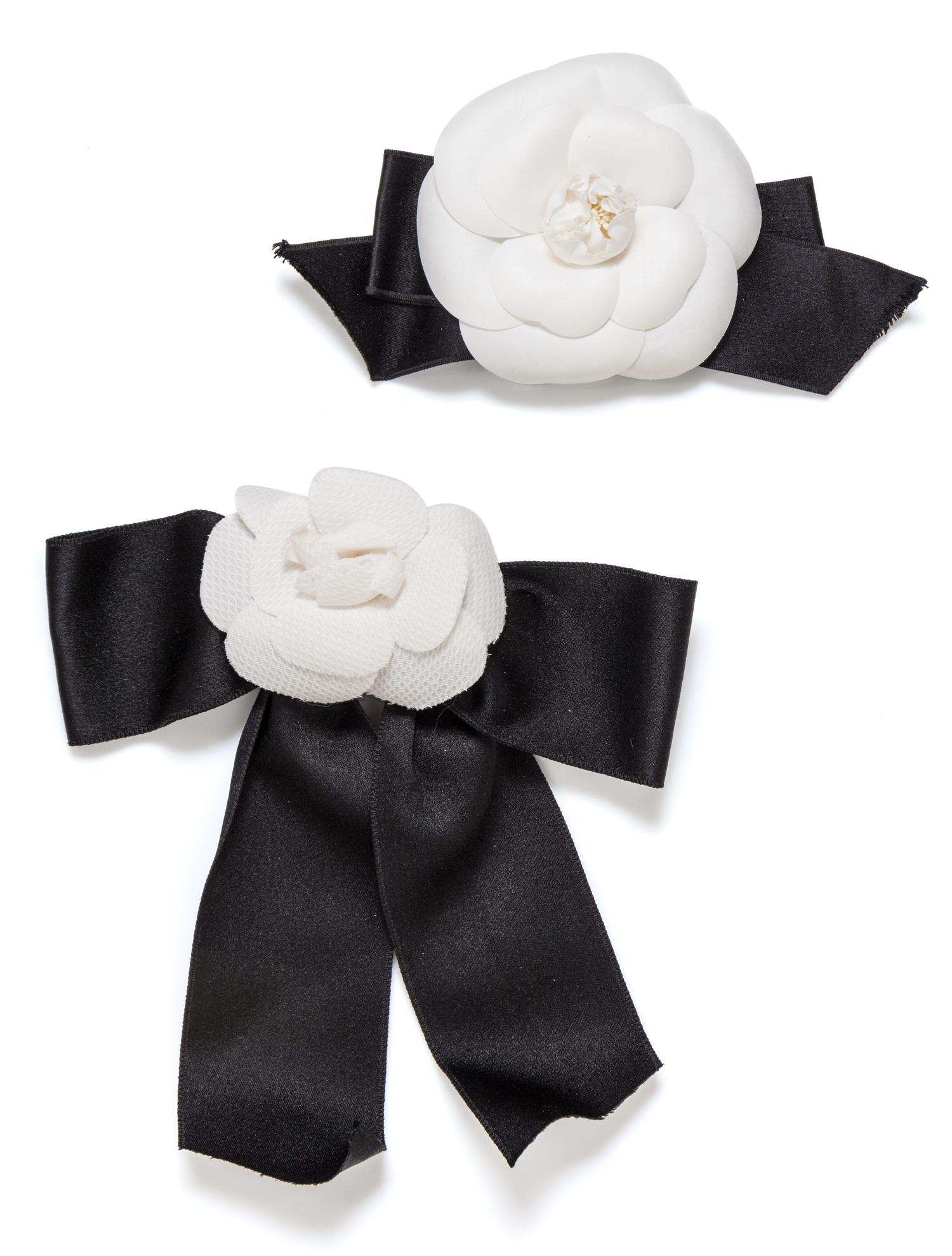 A Pair of Chanel White Camelia and Satin Ribbon Pins, 7.5" x 4", 9" x 7.5".