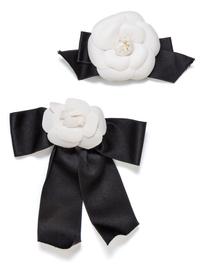 A Pair of Chanel White Camelia and Satin Ribbon Pins, 7.5" x 4", 9" x 7.5".
