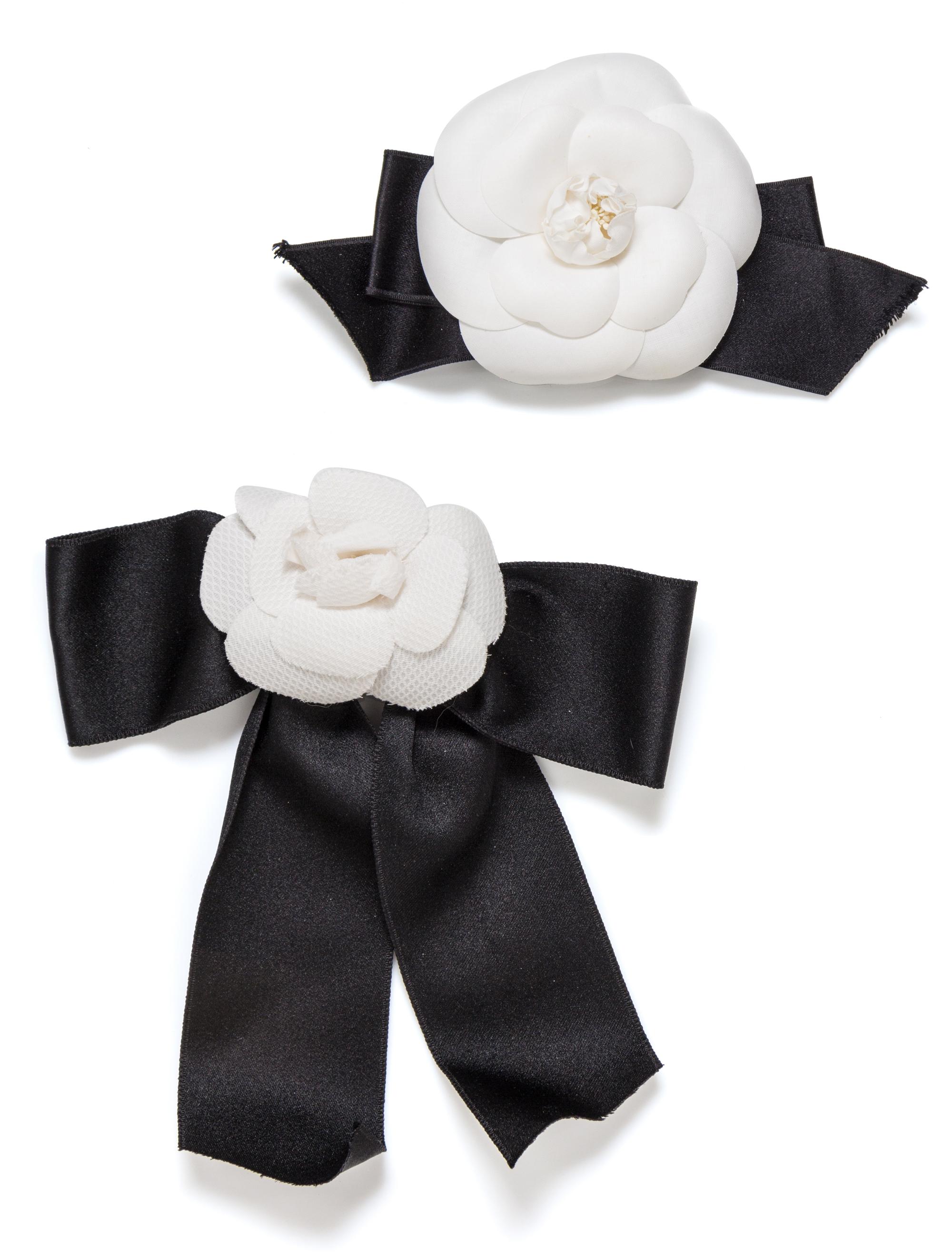 A Pair of Chanel White Camelia and Satin Ribbon Pins, 7.5" x 4", 9" x 7.5".