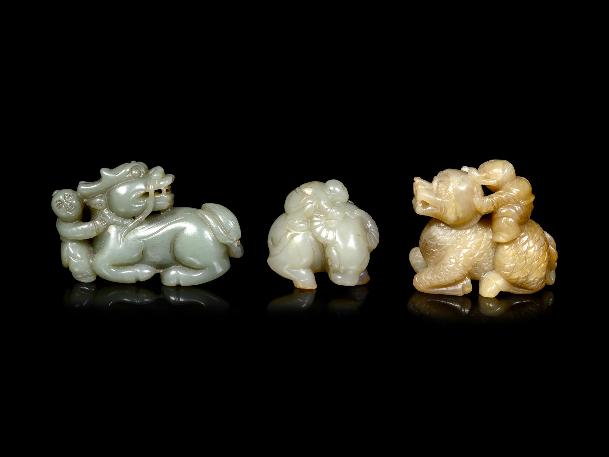 Three Chinese Celadon Jade Figures of Boys