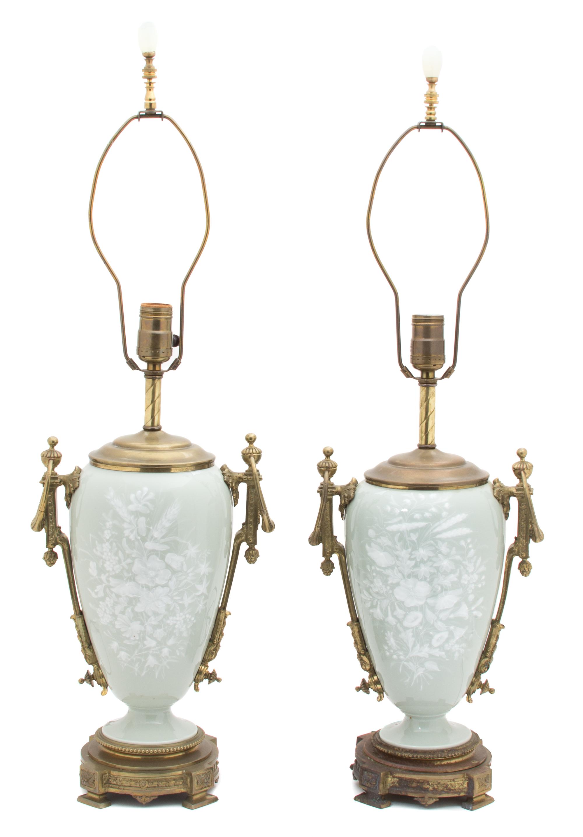 A Pair of French Ormolu Mounted Pate-sur-pate Celadon Glazed Porcelain Lamps Height overall 29 inches. — 19TH CENTURY