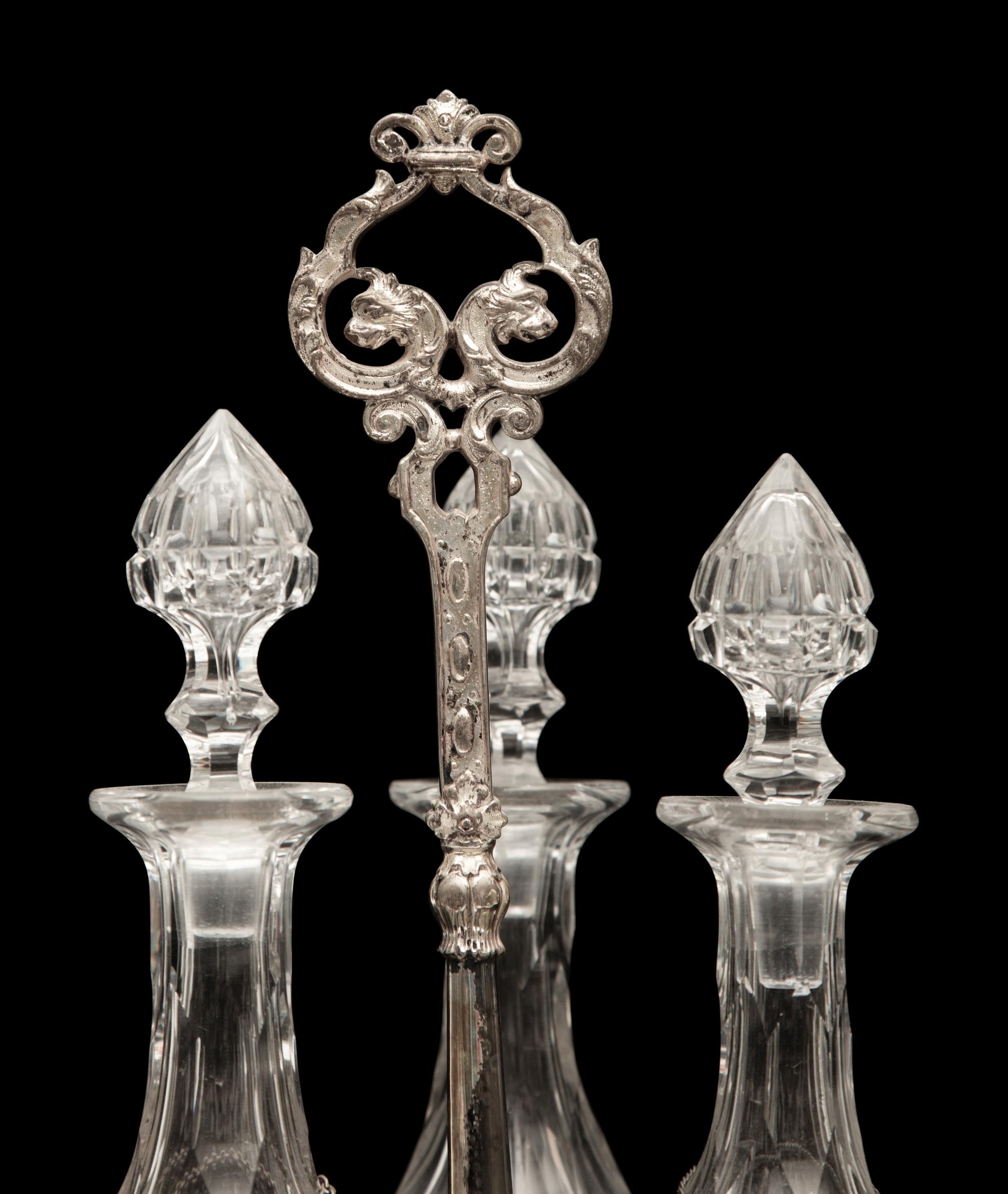 An English Silver-Plate Tantalus with Three Cut Glass Decanters