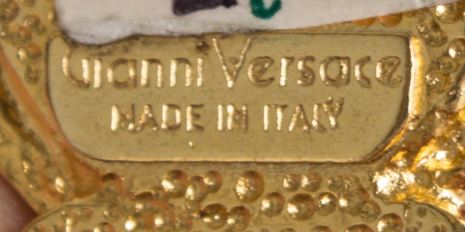 A Gianni Versace Red Embossed Medusa Link Belt, 31" x 1".