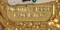 A Gianni Versace Red Embossed Medusa Link Belt, 31" x 1".