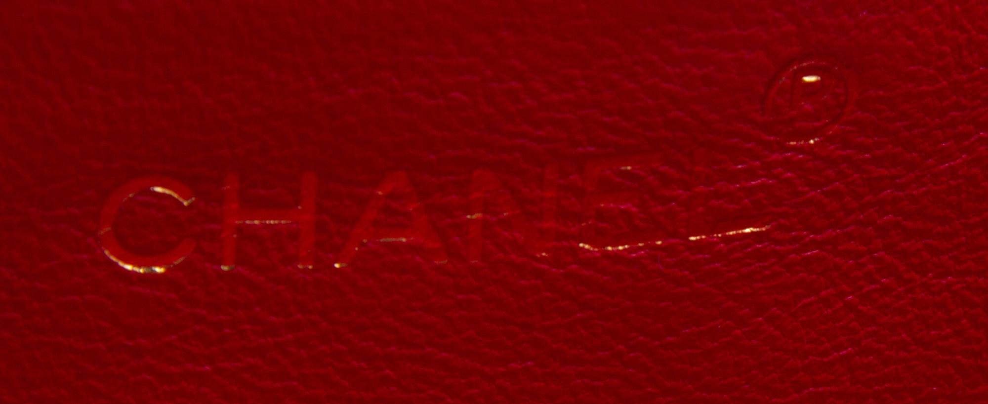 A Chanel Red Leather Quilted Flap Bag, 9" x 7" x 2".