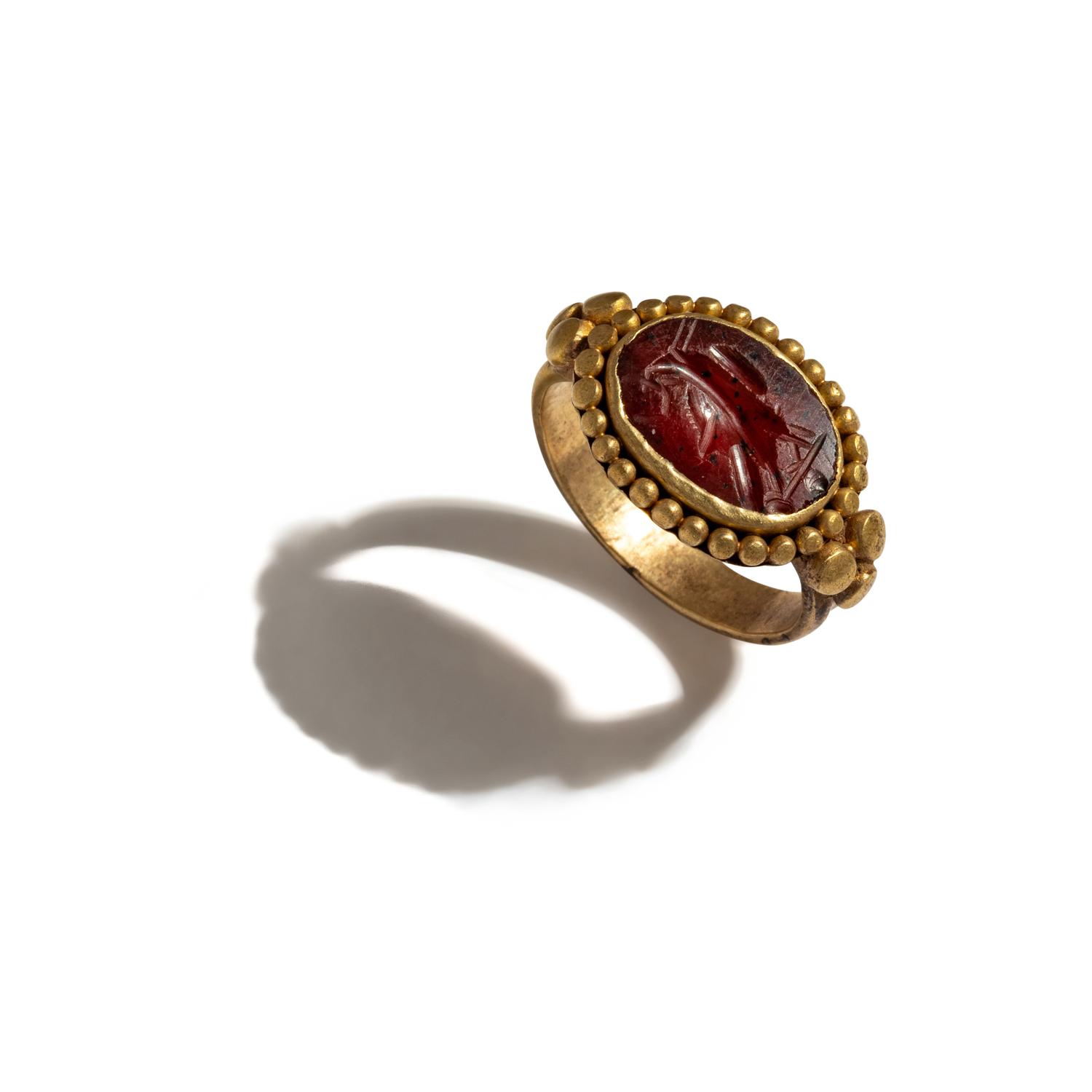 A Roman Gold and Carnelian Finger Ring with an Eagle