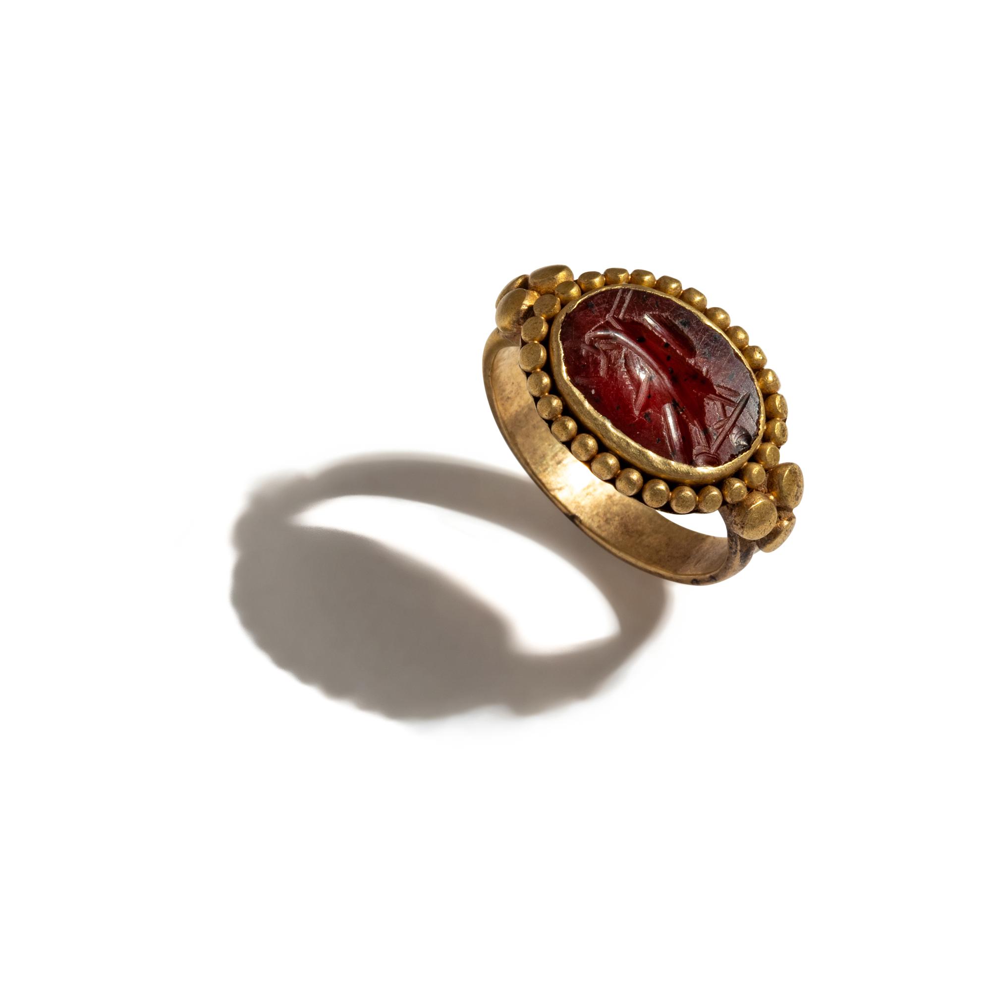 A Roman Gold and Carnelian Finger Ring with an Eagle