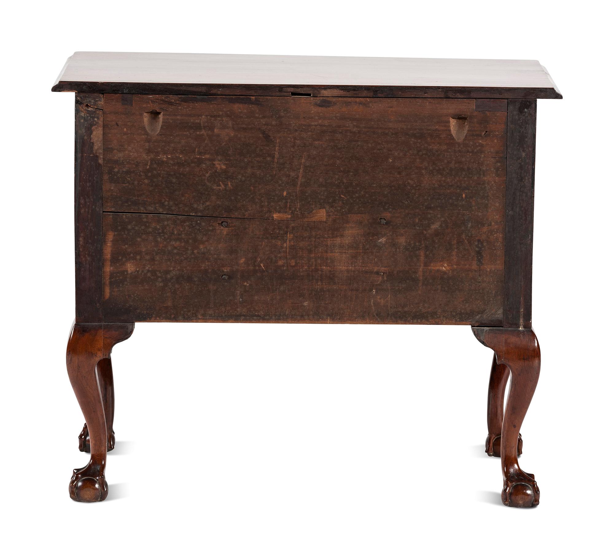 A Chippendale Carved and Figured Walnut Claw-and-Ball Foot Dressing Table