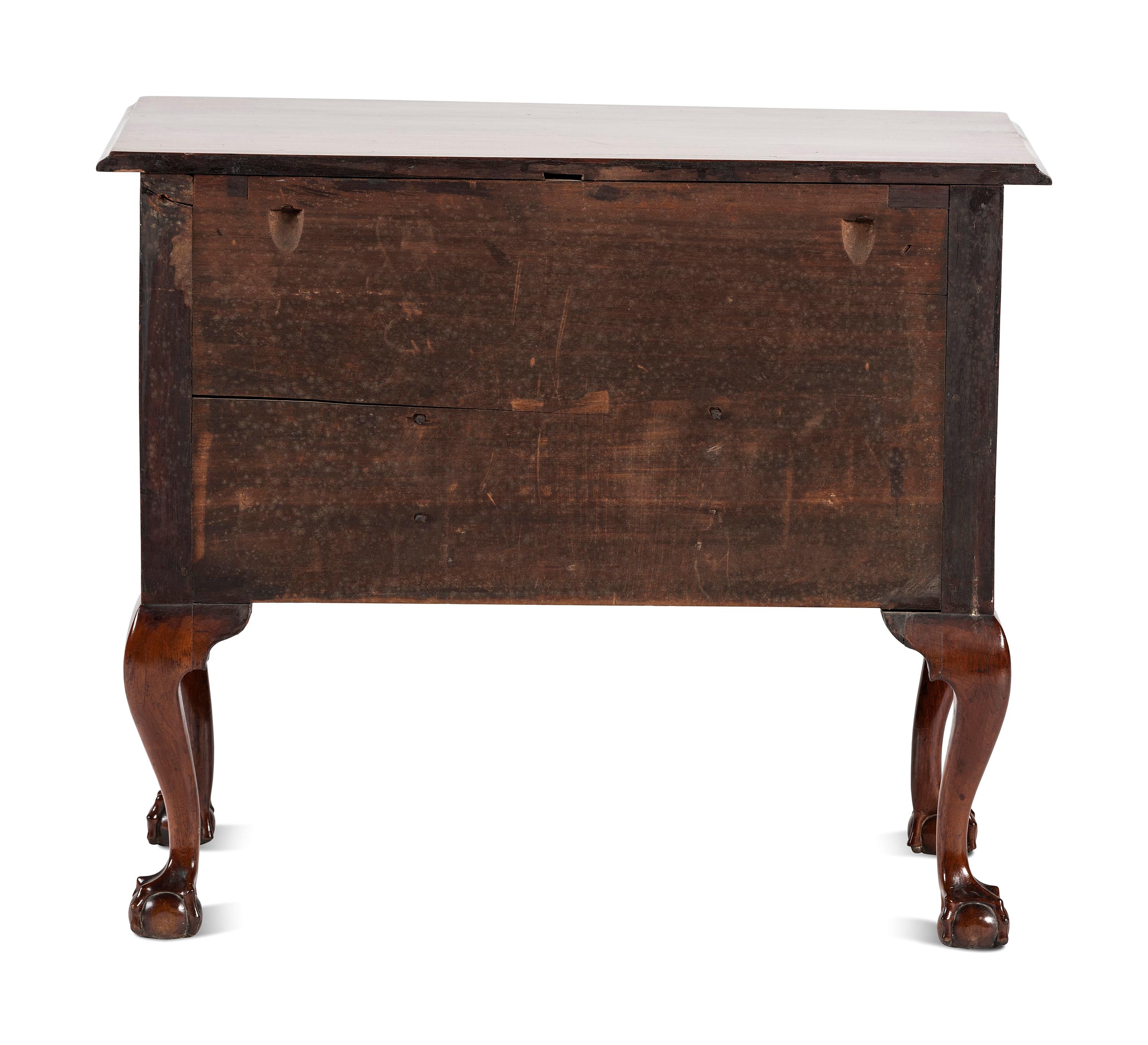 A Chippendale Carved and Figured Walnut Claw-and-Ball Foot Dressing Table