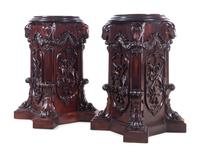 A Pair of George III Style Carved Mahogany Pedestals