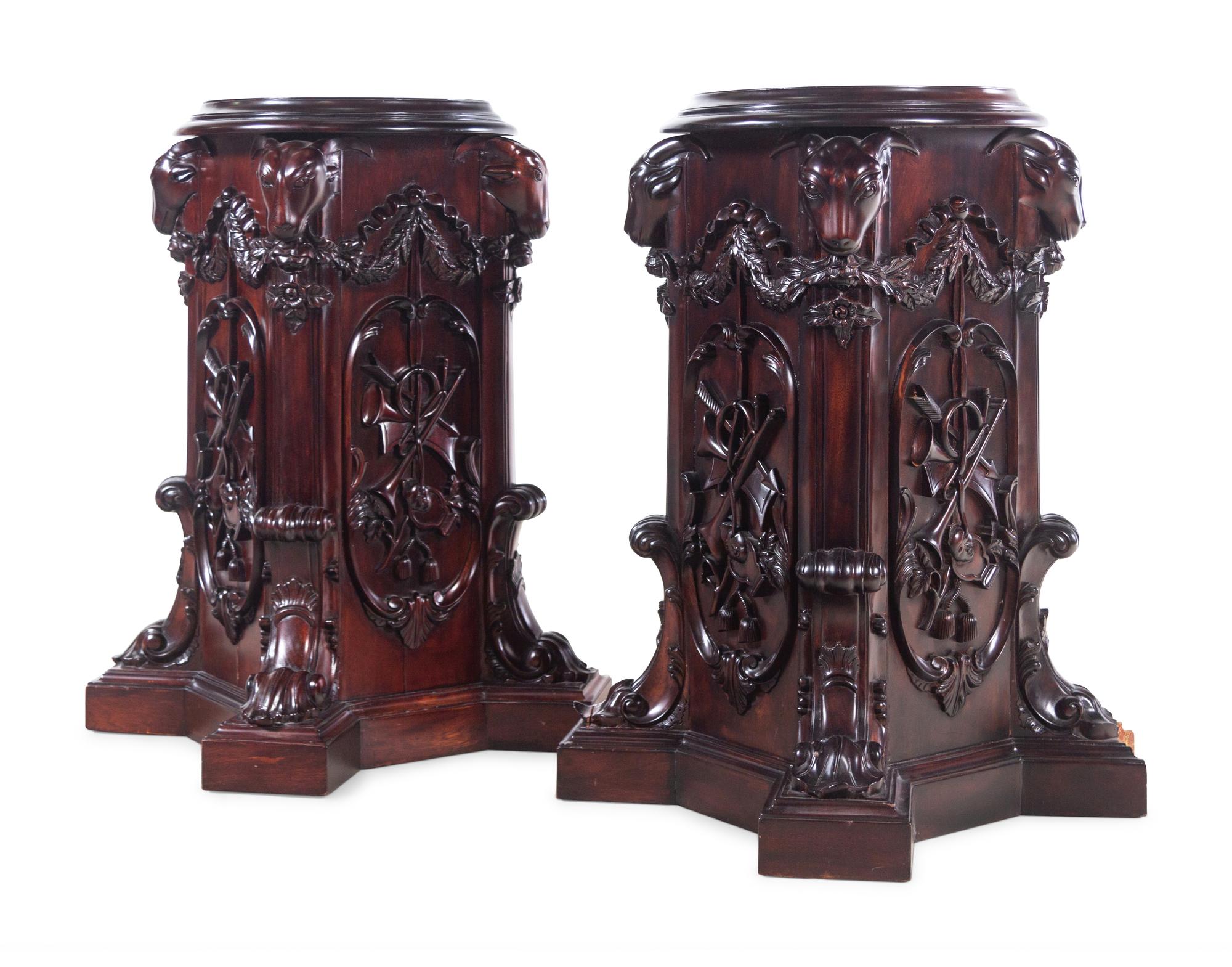 A Pair of George III Style Carved Mahogany Pedestals