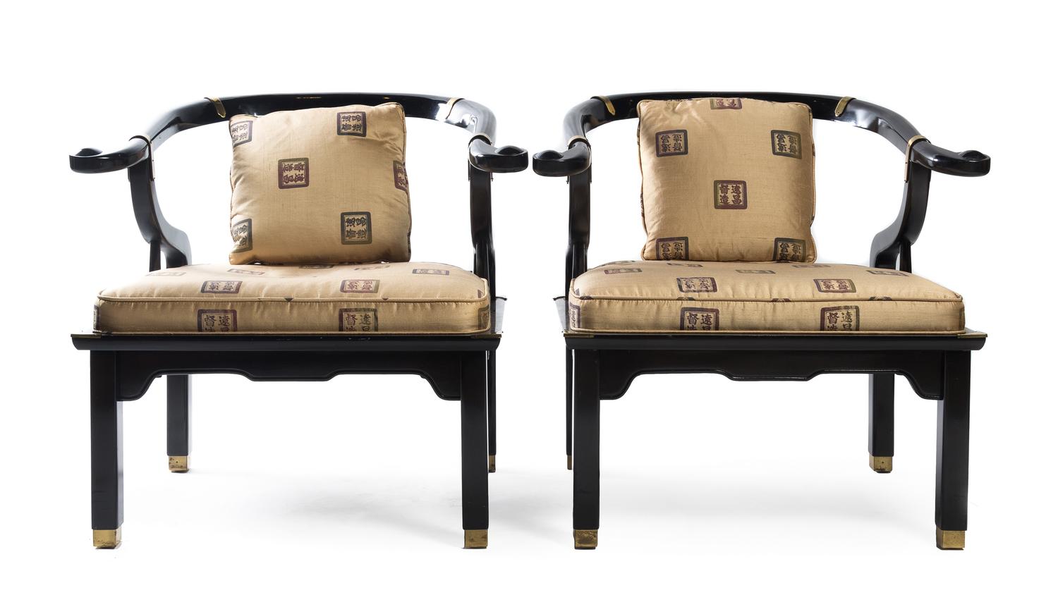 Manner of James Mont, SECOND HALF 20TH CENTURY, a pair of yoke back armchairs with brass mounts.