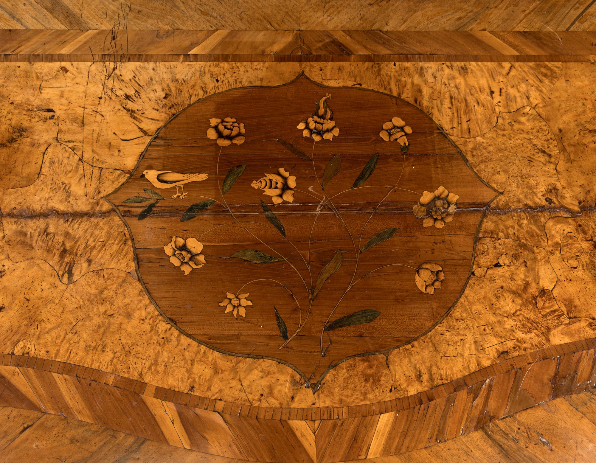 A Continental Gilt Bronze Mounted Burlwood Serpentine Commode