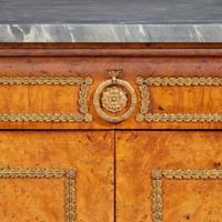 A Charles X gilt bronze-mounted pollard oak side cabinet with Saint Anne marble top circa 1820